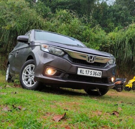 Honda Amaze car fitted with Gmax silver color alloy wheels